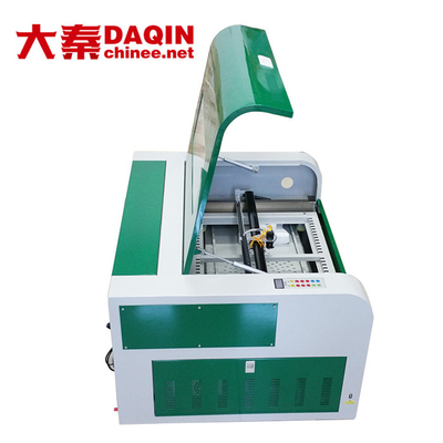 Máquina cortada con tintas de encargo de cristal moderada de la etiqueta engomada 30W, máquina de 30kg Daqin